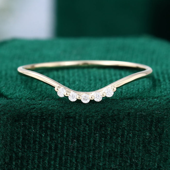 Round moissanite thin curved wedding band, front view in yellow gold