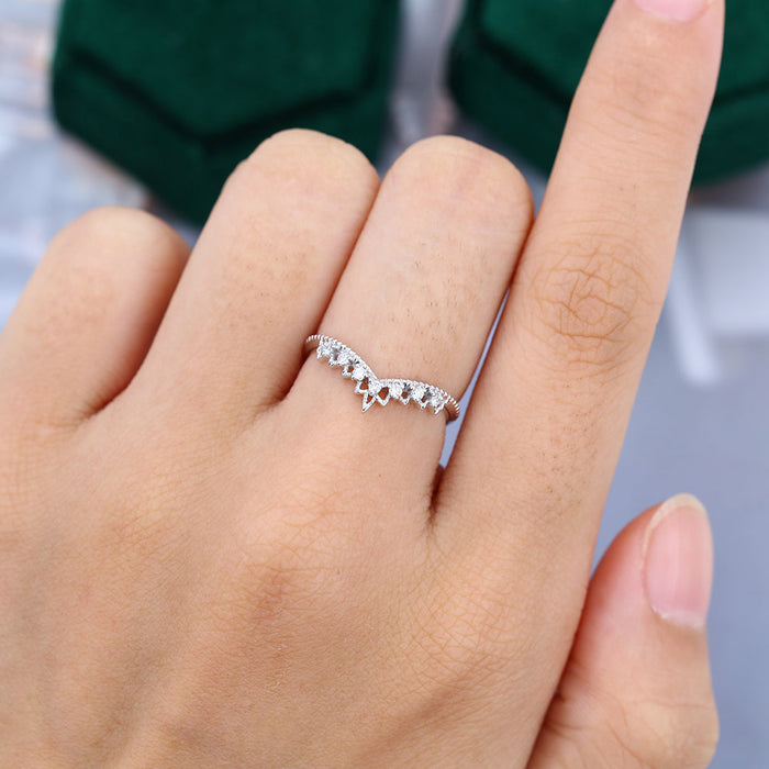 Round moissanite tiara milgrain curved wedding band, worn on the finger in white gold